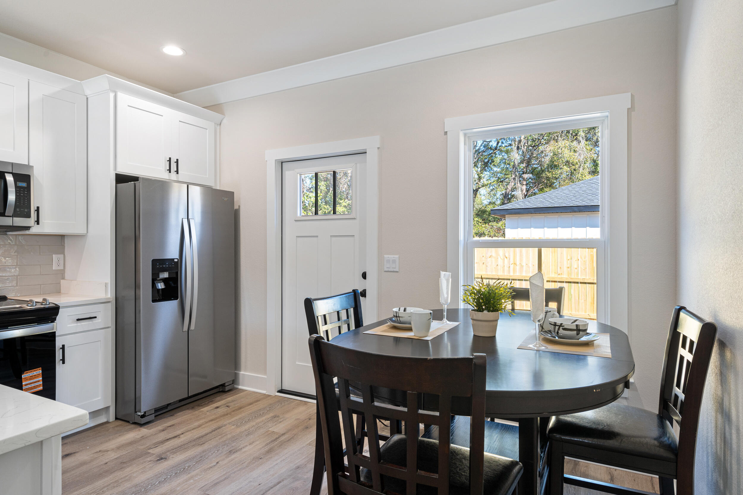 873 Brett Street South Crestview, FL 32539 - Photo 21 of 50 a view of a dining room with furniture window and wooden floor