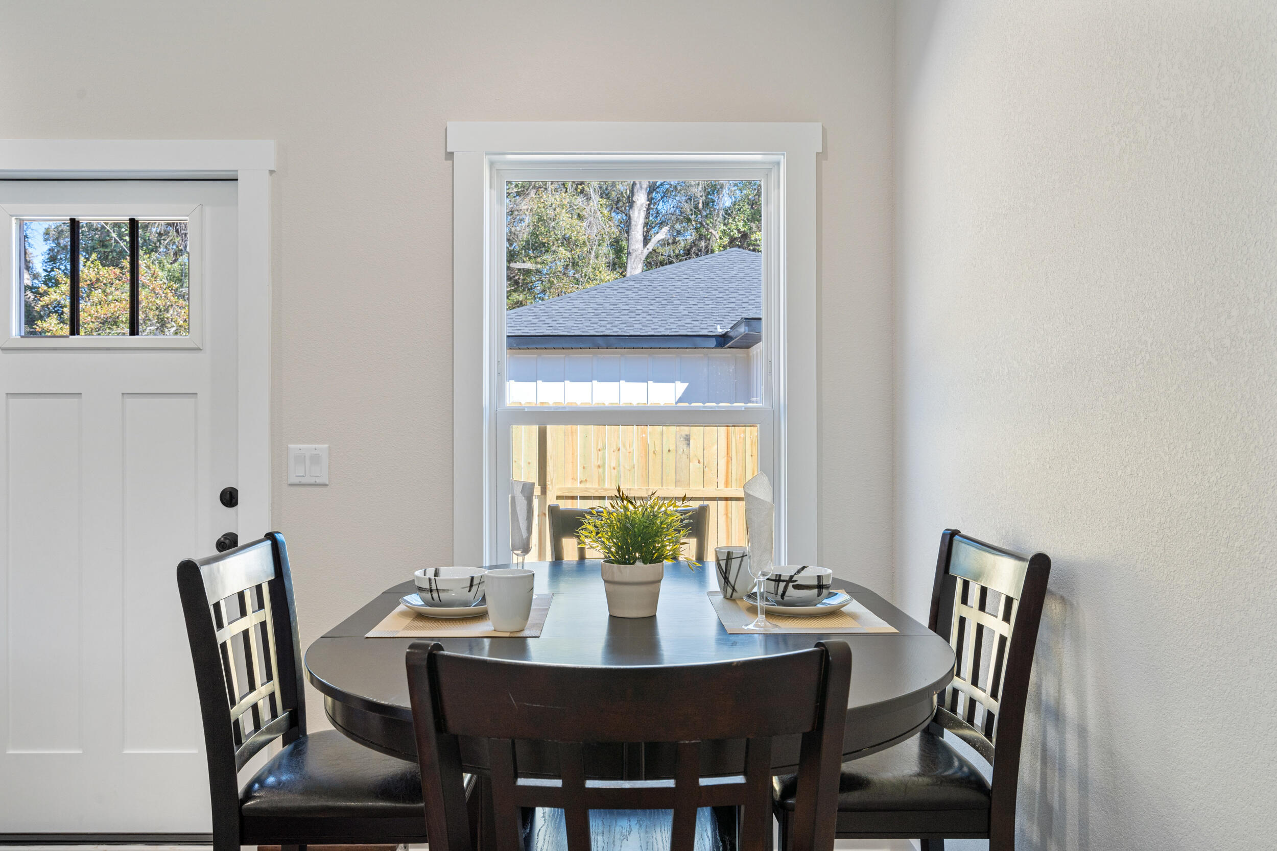 873 Brett Street South Crestview, FL 32539 - Photo 22 of 50 a view of a dining room with furniture a rug and wooden floor