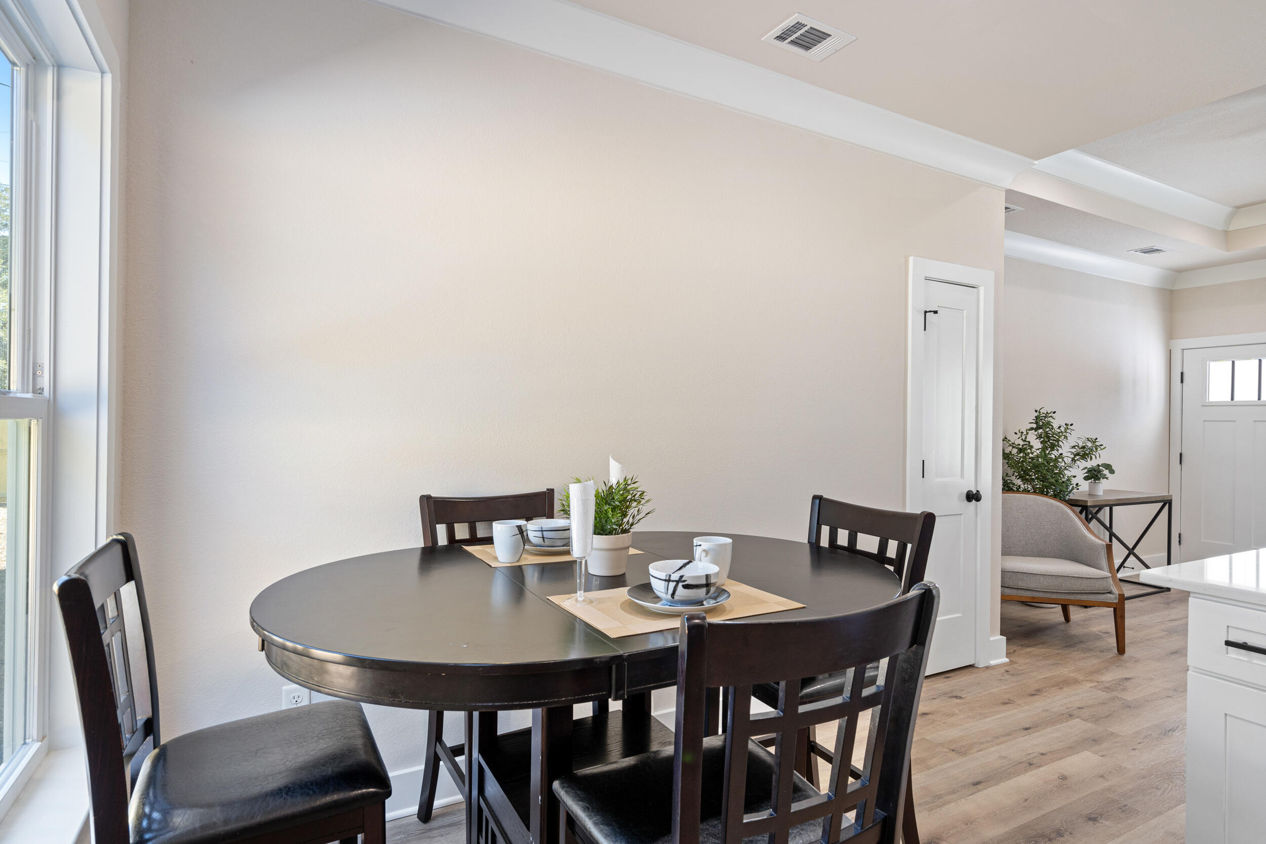 873 Brett Street South Crestview, FL 32539 - Photo 23 of 50 a view of a dining room with furniture and wooden floor
