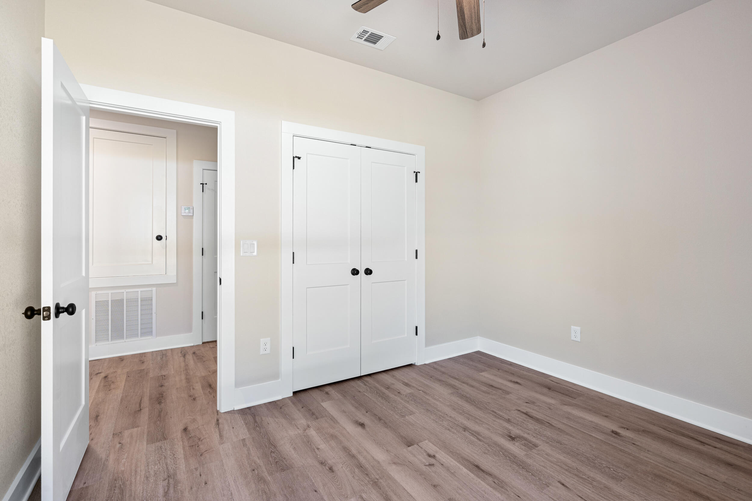 873 Brett Street South Crestview, FL 32539 - Photo 26 of 50 a view of a room with wooden floor