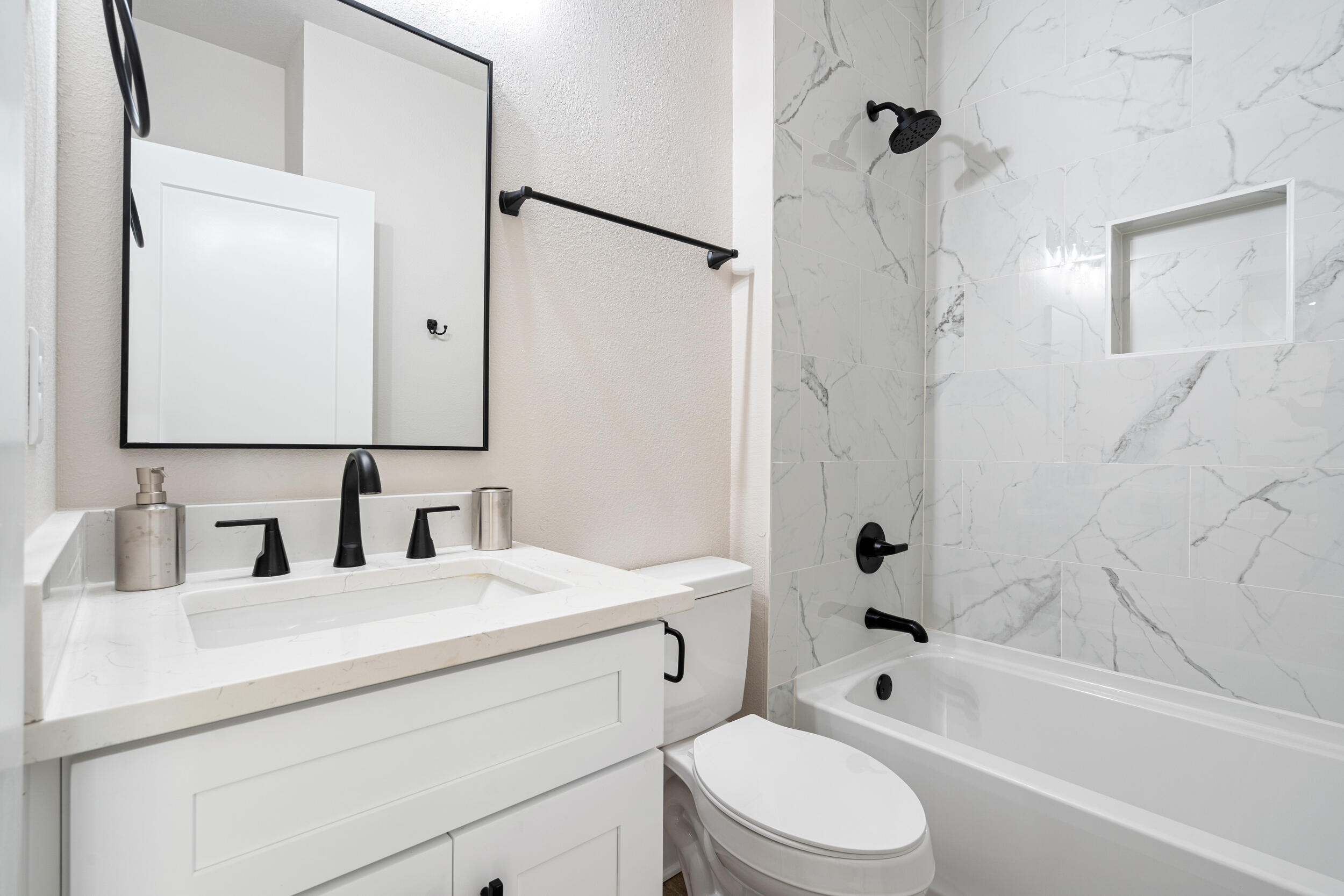 873 Brett Street South Crestview, FL 32539 - Photo 29 of 50 a bathroom with a toilet sink vanity tub and shower