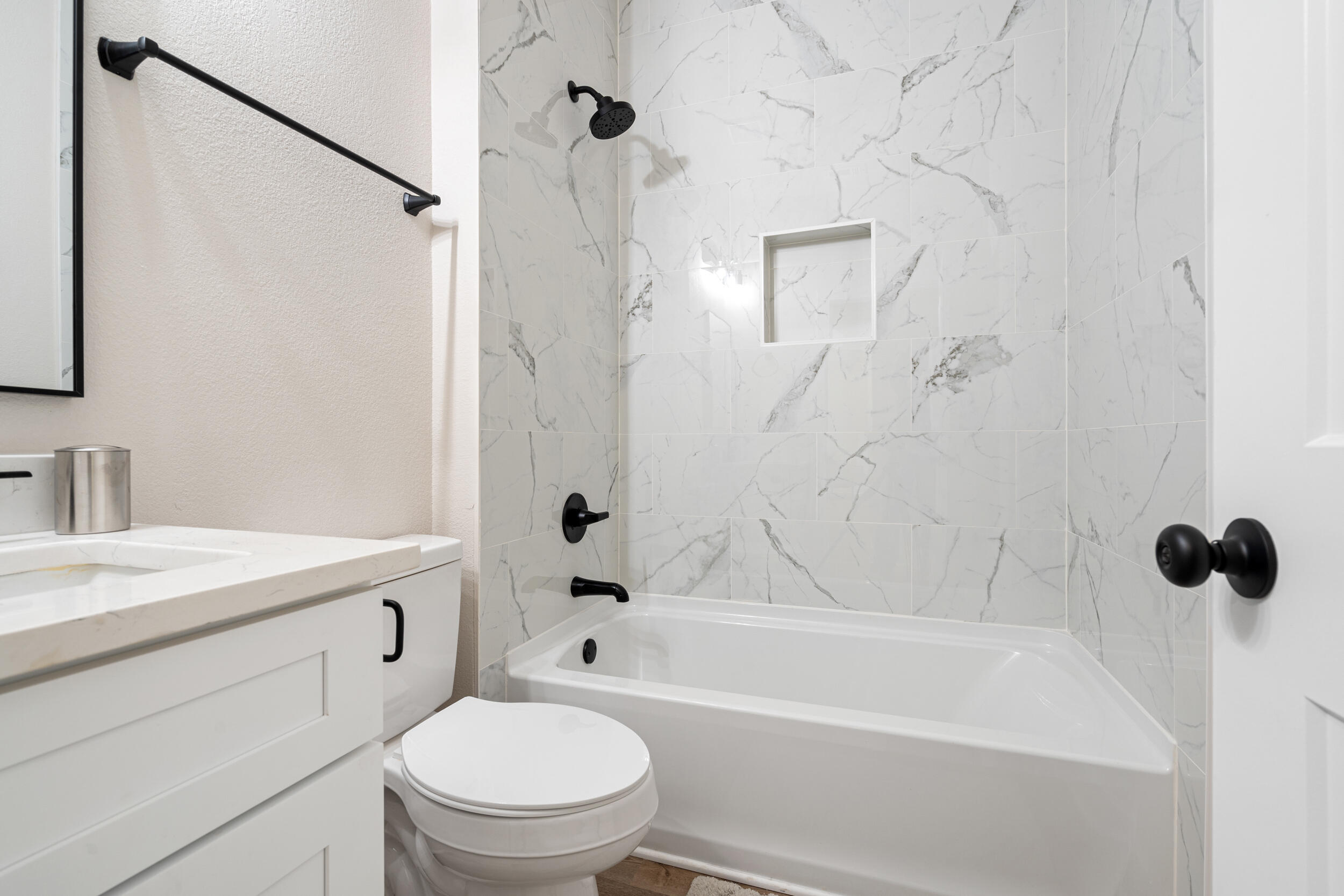873 Brett Street South Crestview, FL 32539 - Photo 30 of 50 a bathroom with a granite countertop bathtub shower sink vanity and toilet