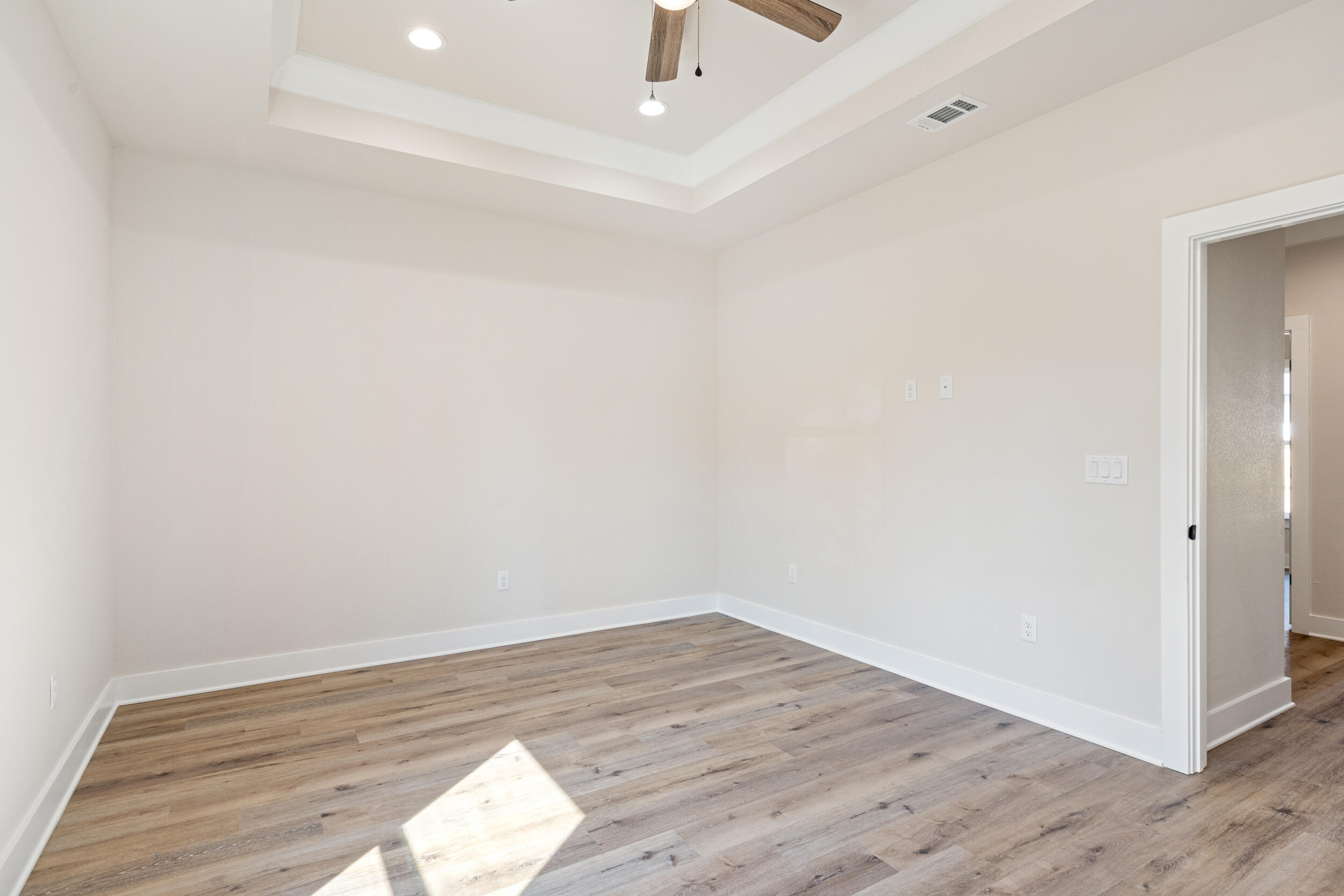 873 Brett Street South Crestview, FL 32539 - Photo 33 of 50 a view of empty room with wooden floor