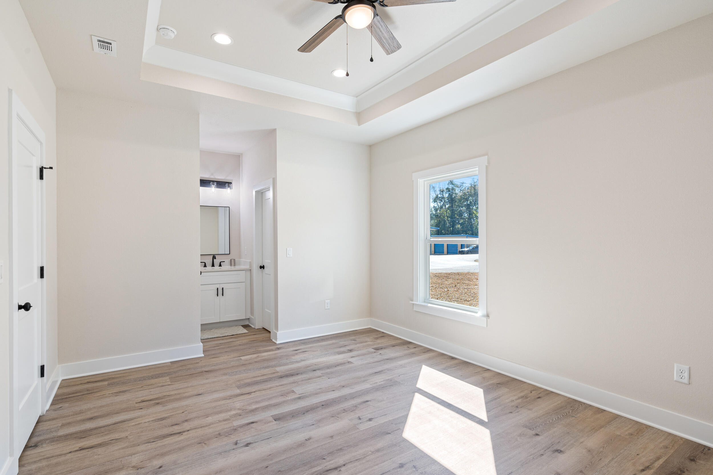 873 Brett Street South Crestview, FL 32539 - Photo 34 of 50 wooden floor in an empty room with a window