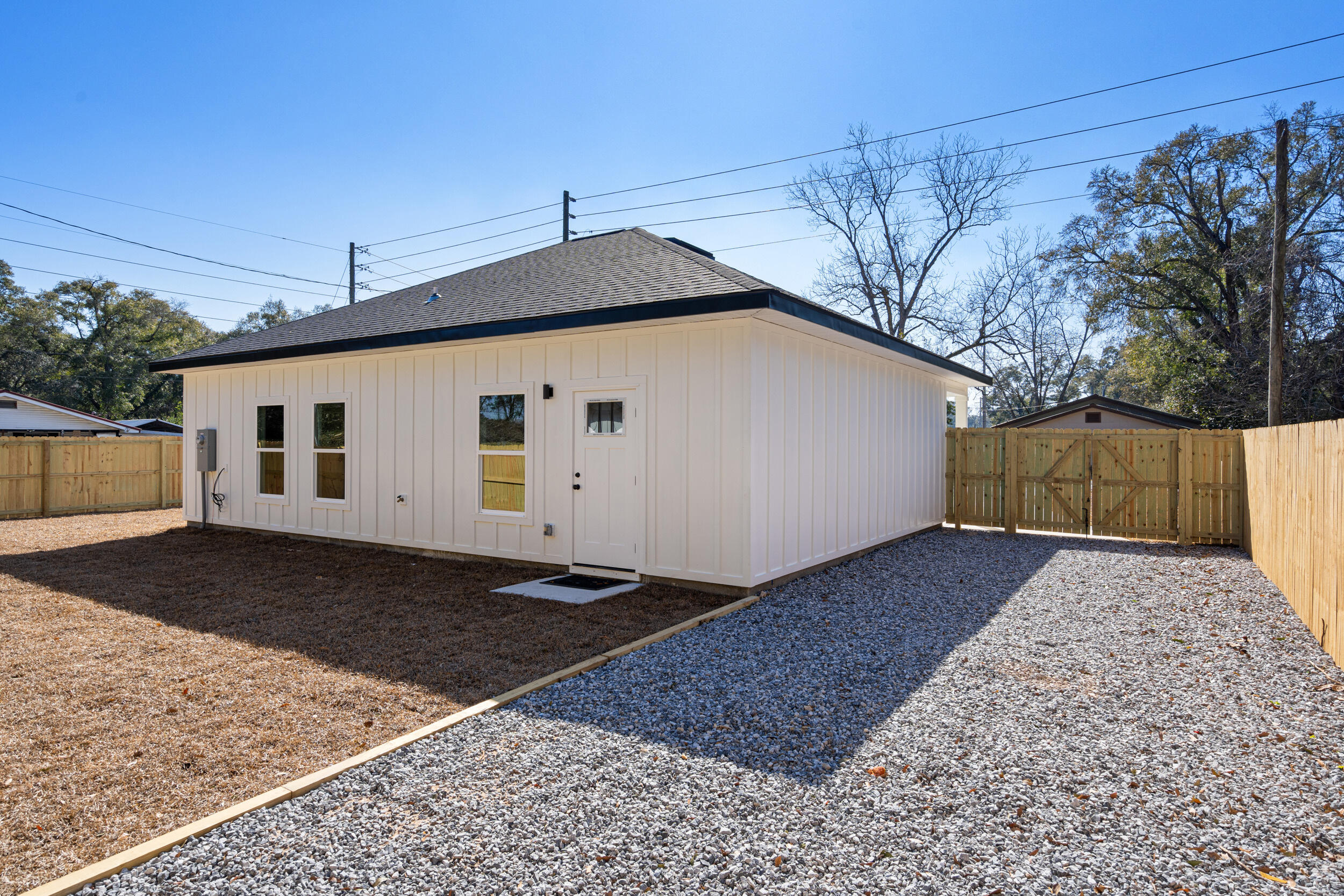 873 Brett Street South Crestview, FL 32539 - Photo 40 of 50 a white house that has a tree on the side of it