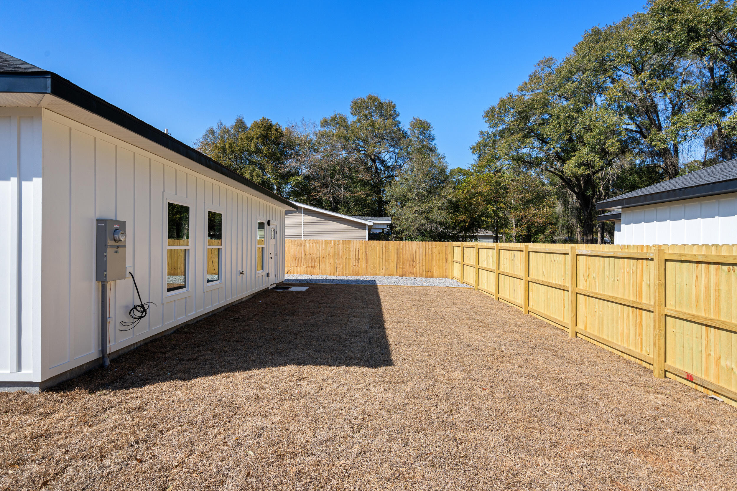 873 Brett Street South Crestview, FL 32539 - Photo 41 of 50 a view of a back yard with a house