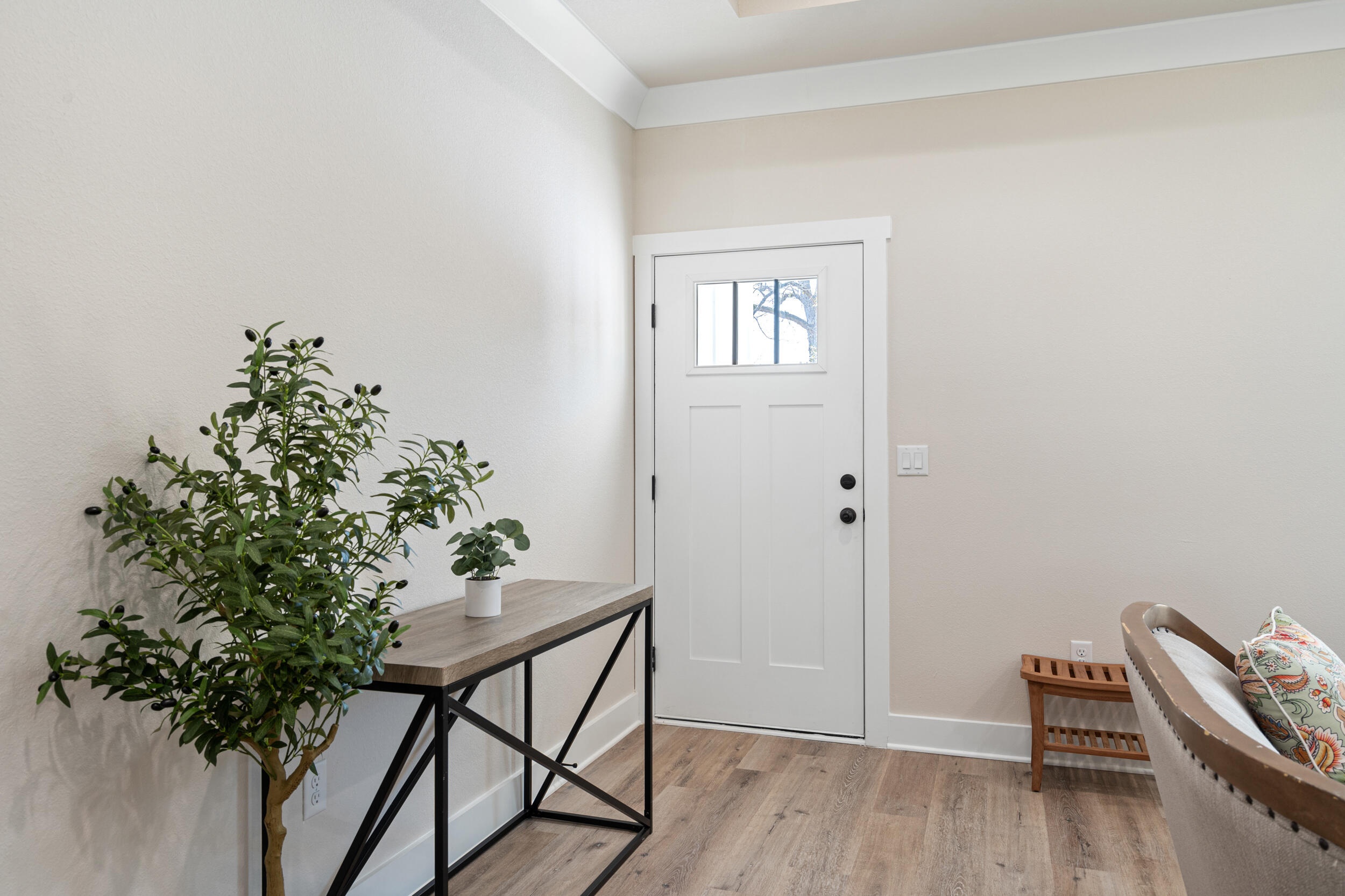 873 Brett Street South Crestview, FL 32539 - Photo 10 of 50 a room with a potted plant and wooden floor