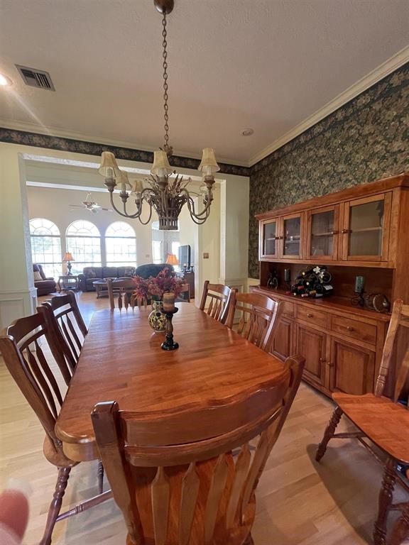 1655 Wooten Road Beaumont, TX 77707 - Photo 17 of 46 a room with lots of tables a dining table and chairs