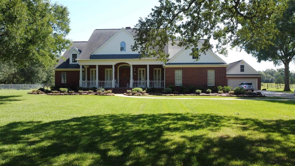 1655 Wooten Road Beaumont, TX 77707 - Photo 2 of 46 a front view of house with swimming pool and green space