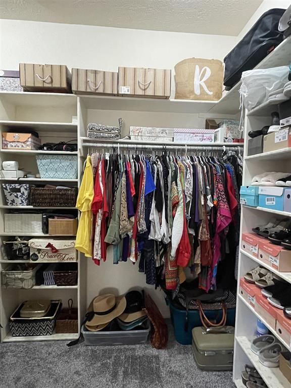 1655 Wooten Road Beaumont, TX 77707 - Photo 24 of 46 a view of walk in closet with clothes and shoes
