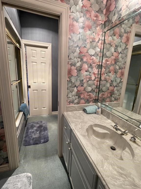 1655 Wooten Road Beaumont, TX 77707 - Photo 28 of 46 a bathroom with a granite countertop sink a toilet and shower