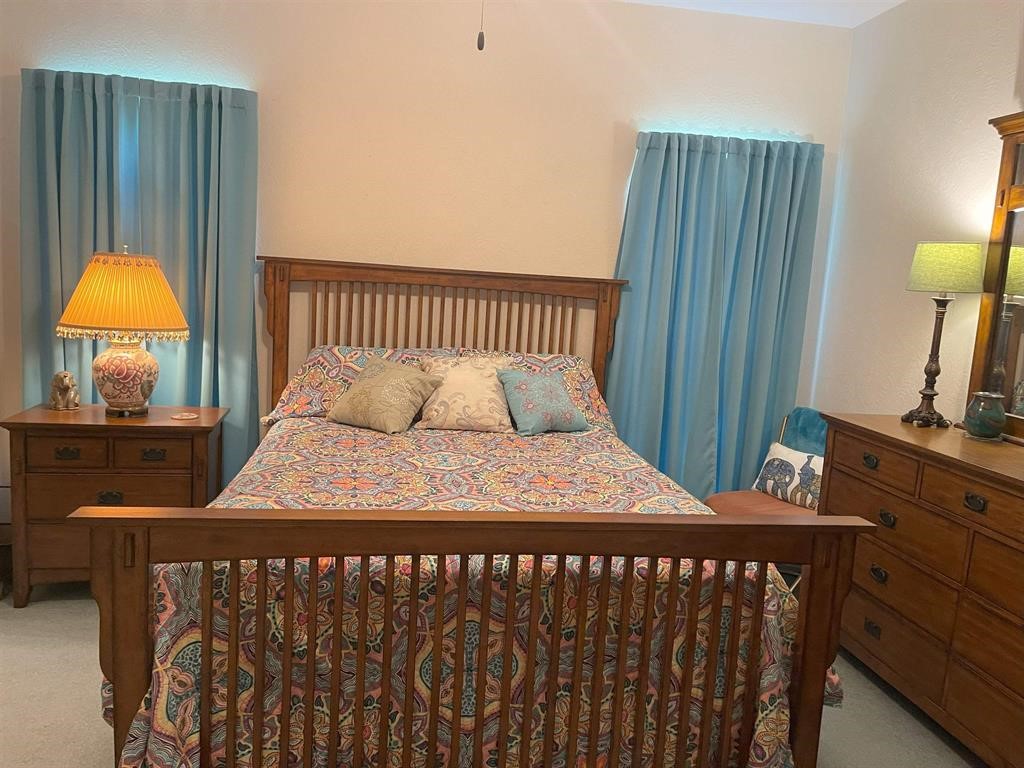 1655 Wooten Road Beaumont, TX 77707 - Photo 29 of 46 a bedroom with a bed and window