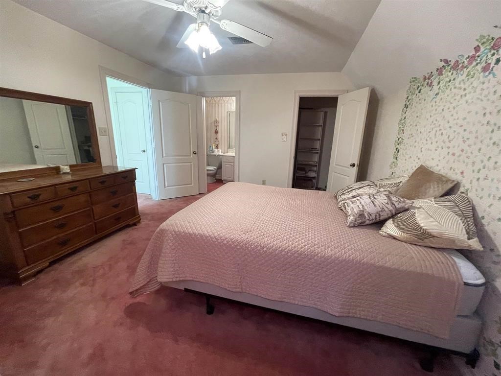 1655 Wooten Road Beaumont, TX 77707 - Photo 30 of 46 a bedroom with a bed and a dresser