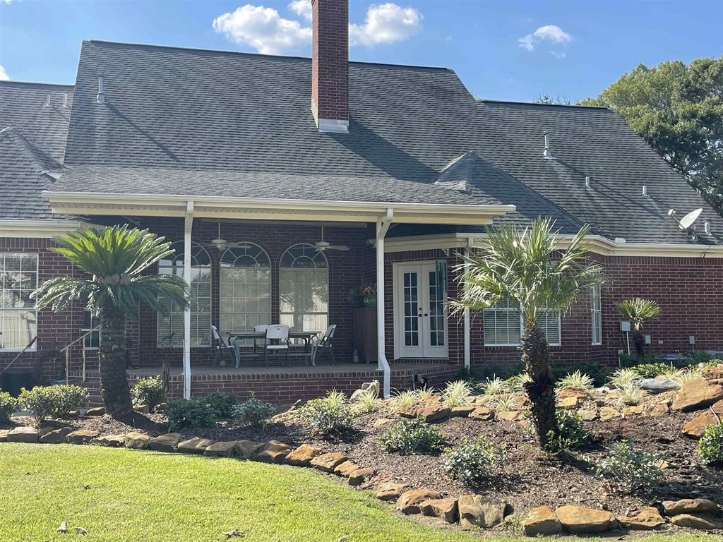 1655 Wooten Road Beaumont, TX 77707 - Photo 31 of 46 a front view of a house with garden