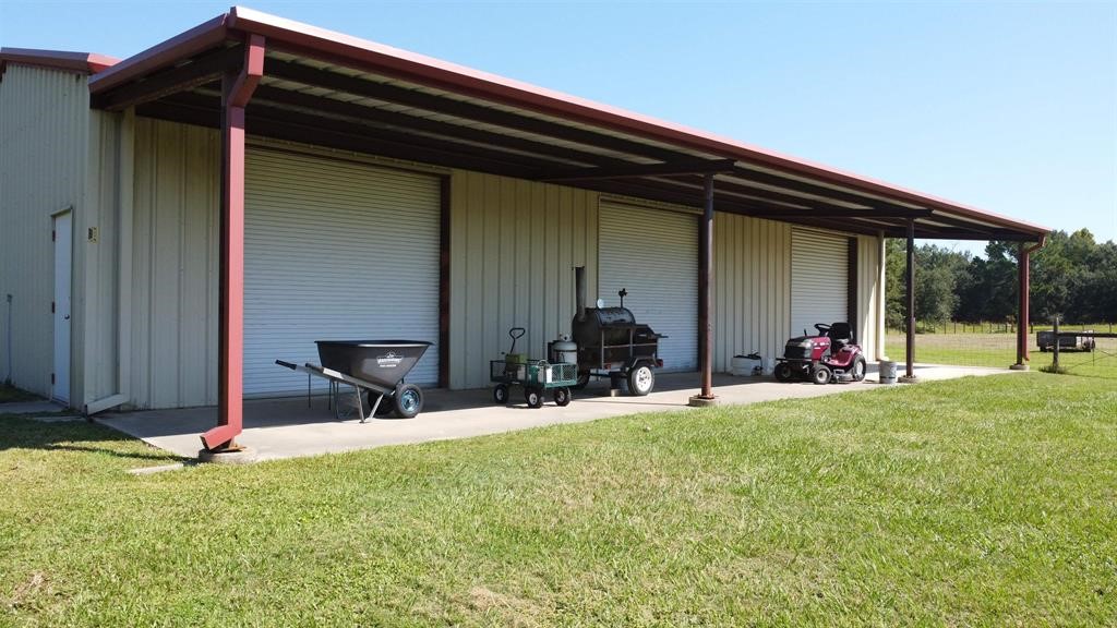 1655 Wooten Road Beaumont, TX 77707 - Photo 33 of 46 a view of a backyard with table and chairs and potted plants