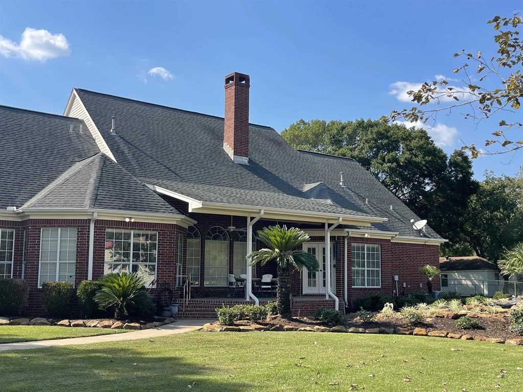 1655 Wooten Road Beaumont, TX 77707 - Photo 43 of 46 a front view of a house with garden