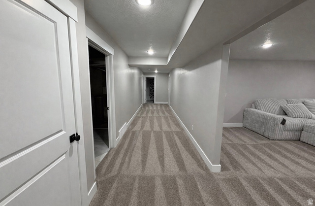 2350 North 1075 West Helper, UT 84526 - Photo 27 of 49 Corridor featuring light carpet, a textured ceiling, and recessed lighting
