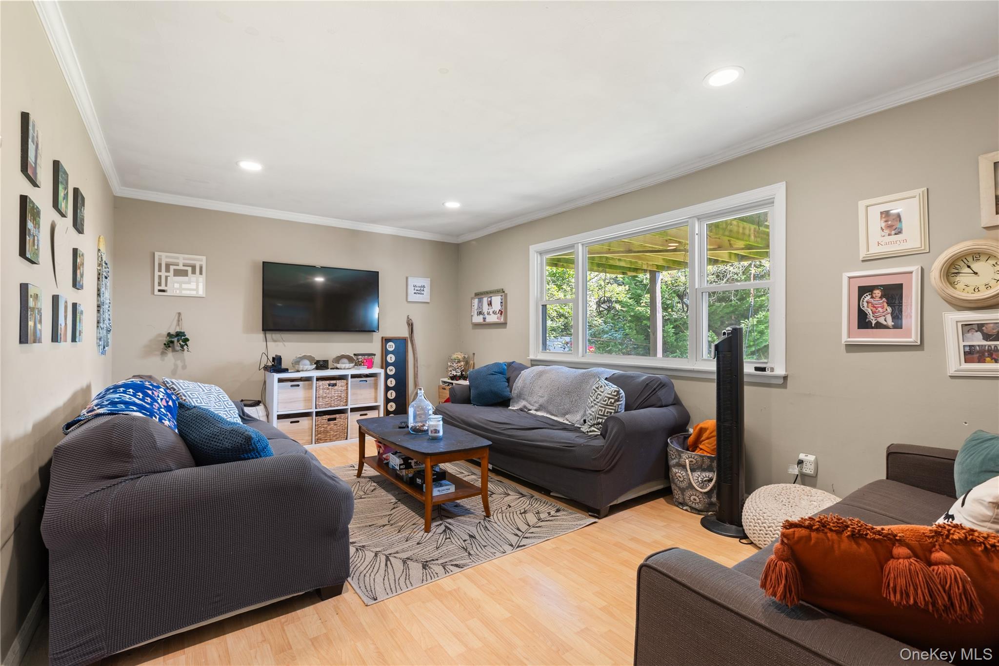 116 Cross Road Oakdale, NY 11769 - Photo 13 of 26 a living room with furniture and a flat screen tv