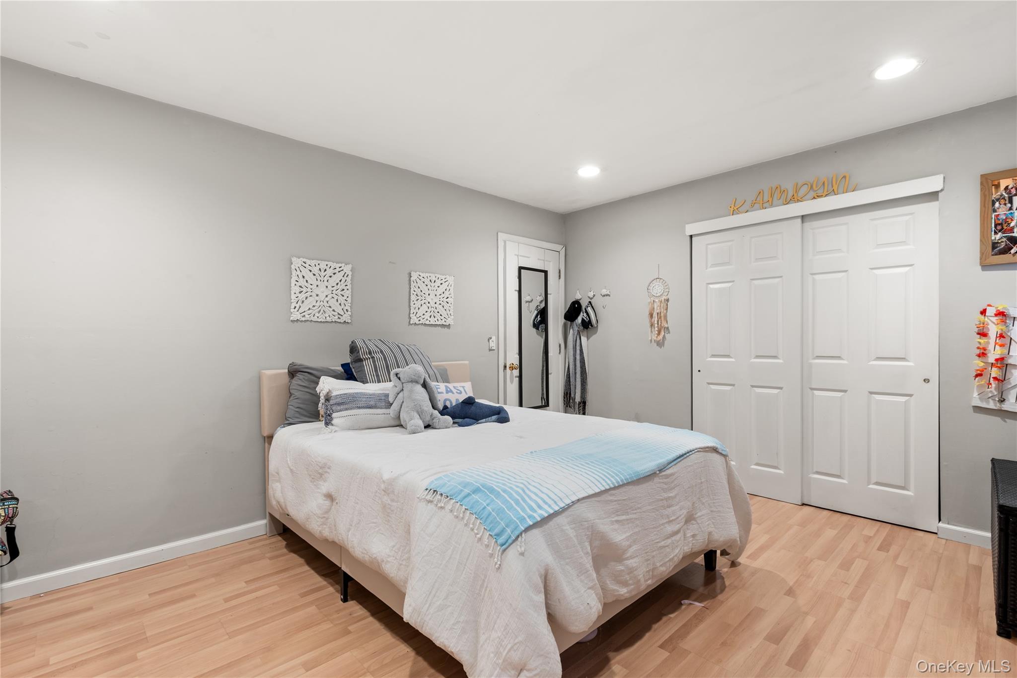 116 Cross Road Oakdale, NY 11769 - Photo 15 of 26 a bedroom with a bed and a table