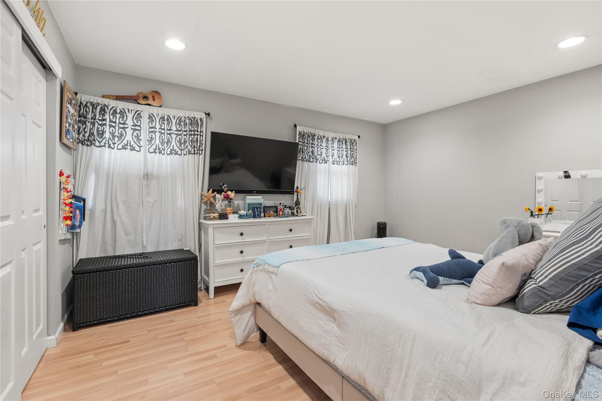 116 Cross Road Oakdale, NY 11769 - Photo 16 of 26 a bedroom with a bed and a flat screen tv