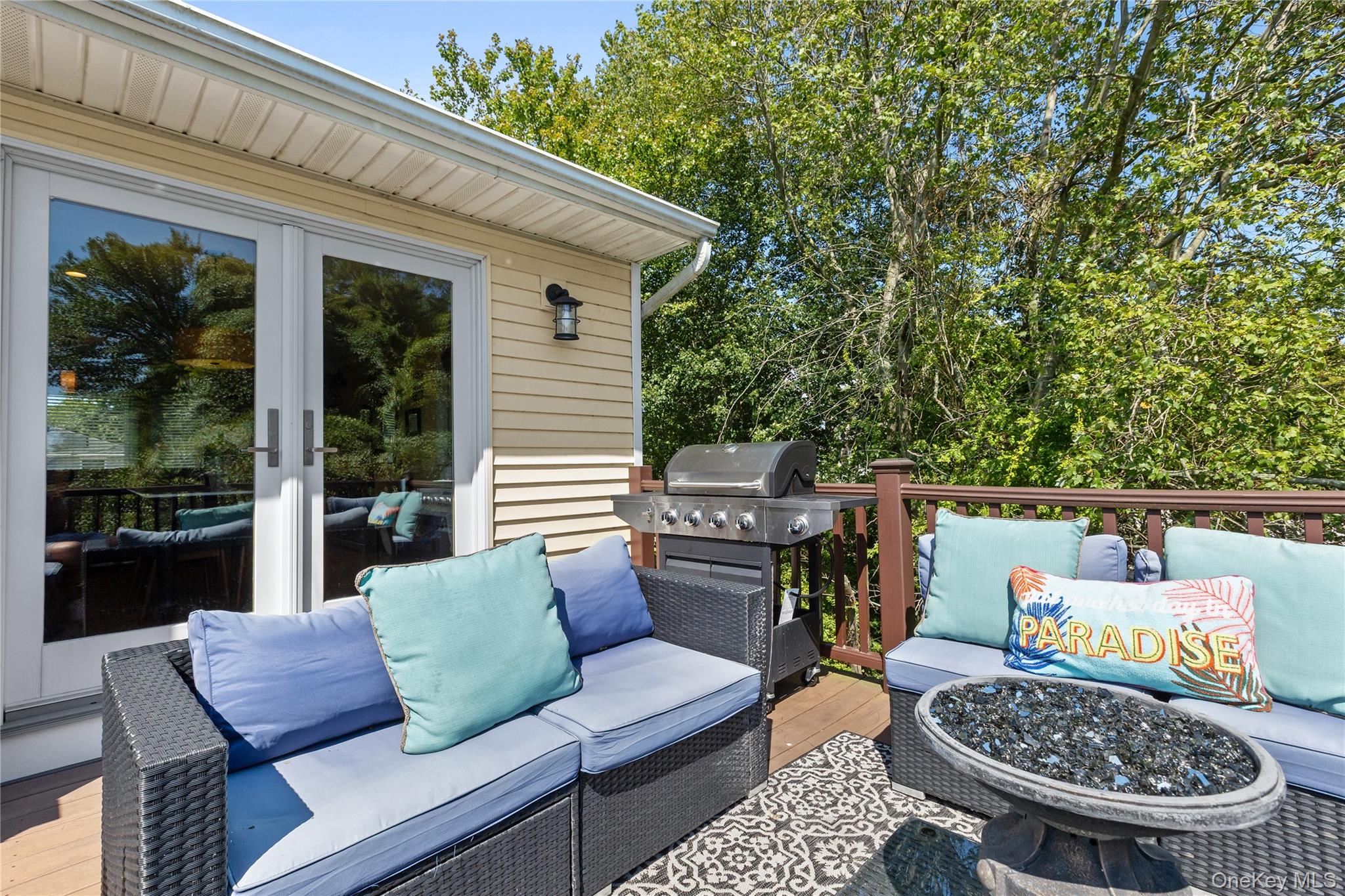 116 Cross Road Oakdale, NY 11769 - Photo 19 of 26 a view of a patio with a dining table and chairs