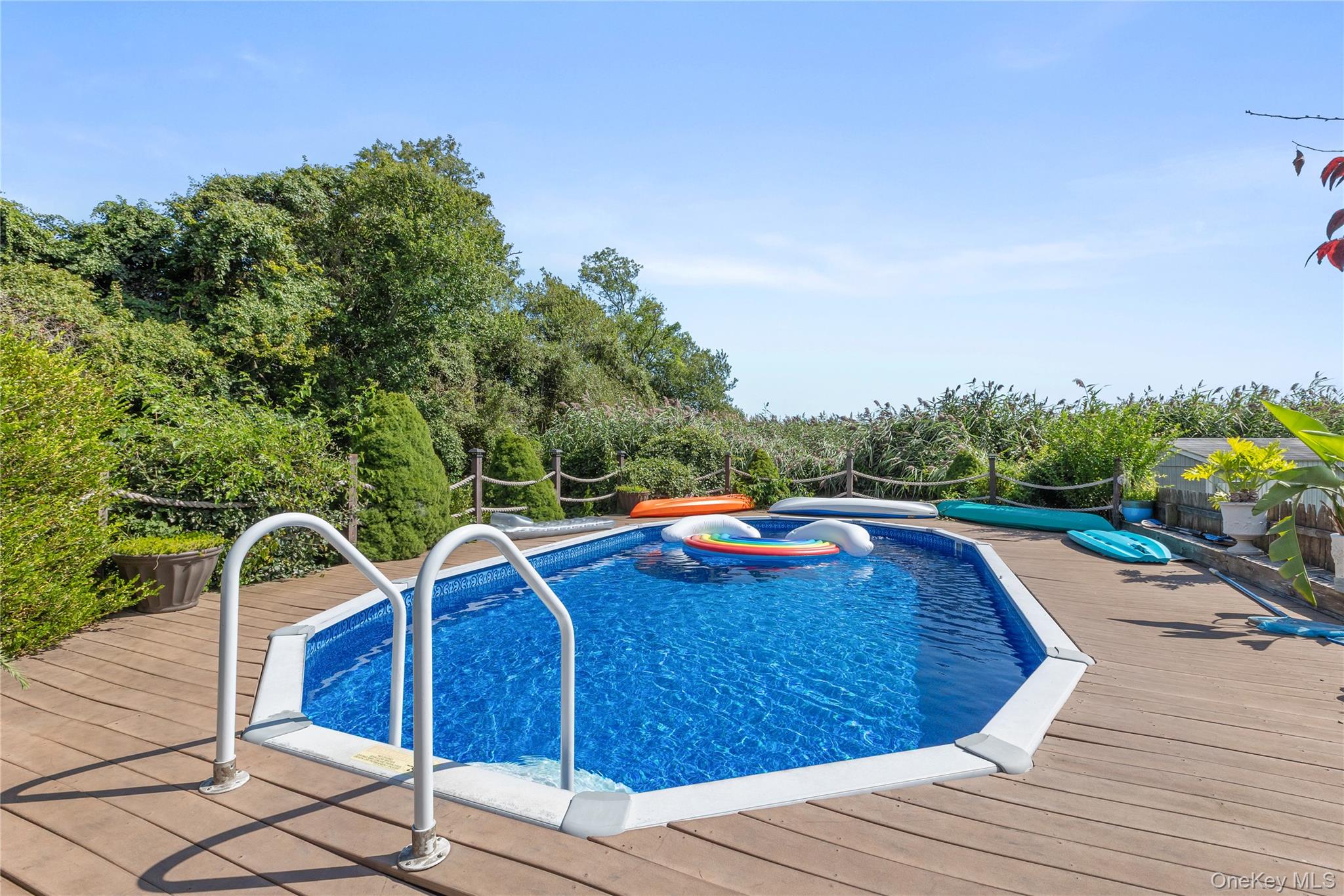 116 Cross Road Oakdale, NY 11769 - Photo 24 of 26 a view of a swimming pool with a lounge chair