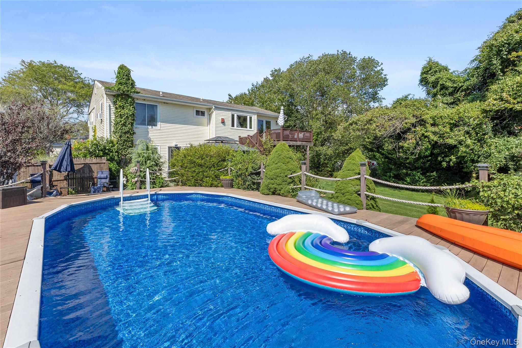 116 Cross Road Oakdale, NY 11769 - Photo 25 of 26 a view of a swimming pool with an outdoor space and seating area