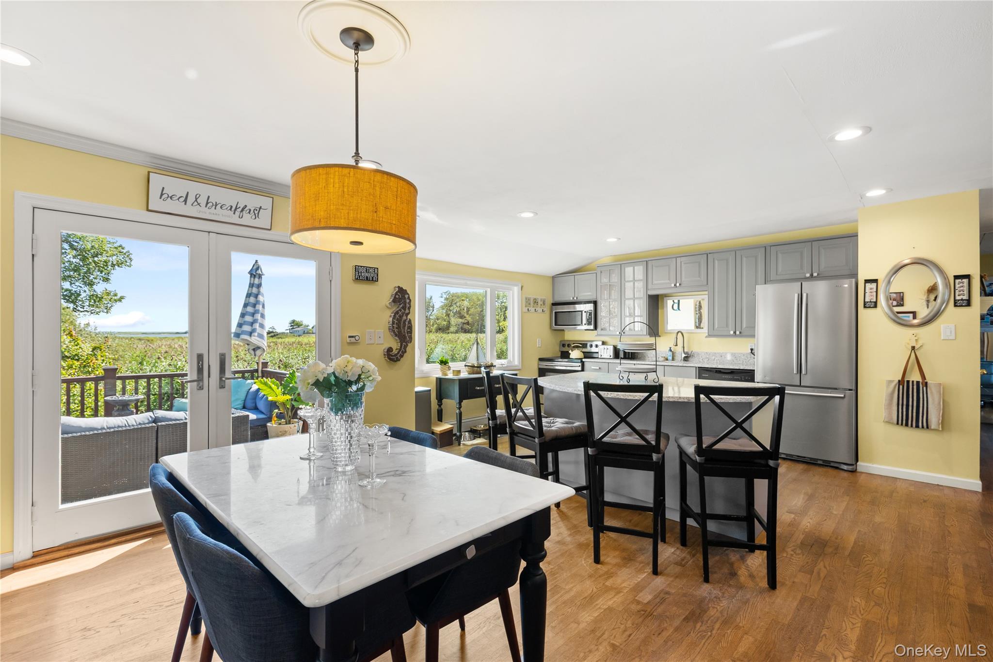 116 Cross Road Oakdale, NY 11769 - Photo 5 of 26 a view of a dining room with furniture window and wooden floor