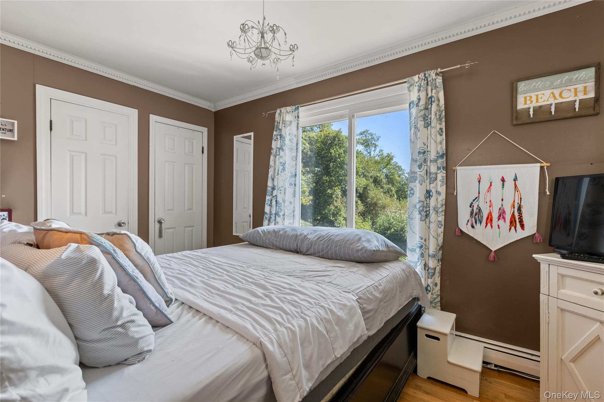 116 Cross Road Oakdale, NY 11769 - Photo 9 of 26 a bedroom with a bed and a window