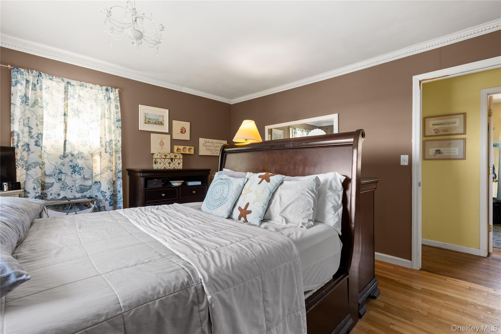 116 Cross Road Oakdale, NY 11769 - Photo 10 of 26 a bedroom with a bed and wooden floor