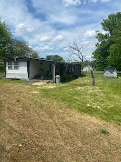 4309 Joe Peay Cemetery Road Spring Hill, TN 37174 - Photo 8 of 8 a backyard of a house with yard and garage