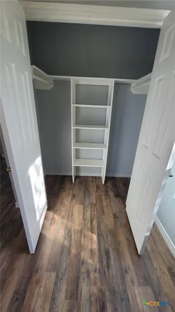 a bathroom with a double vanity sink and mirror