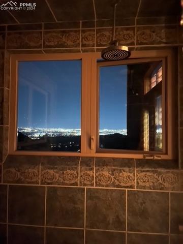 915 Oak Ridge Road Manitou Springs, CO 80829 - Photo 43 of 50 City lights view from primary shower!