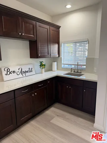 a kitchen with stainless steel appliances granite countertop a sink and cabinets