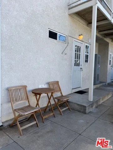 a view of a room with chairs and a table