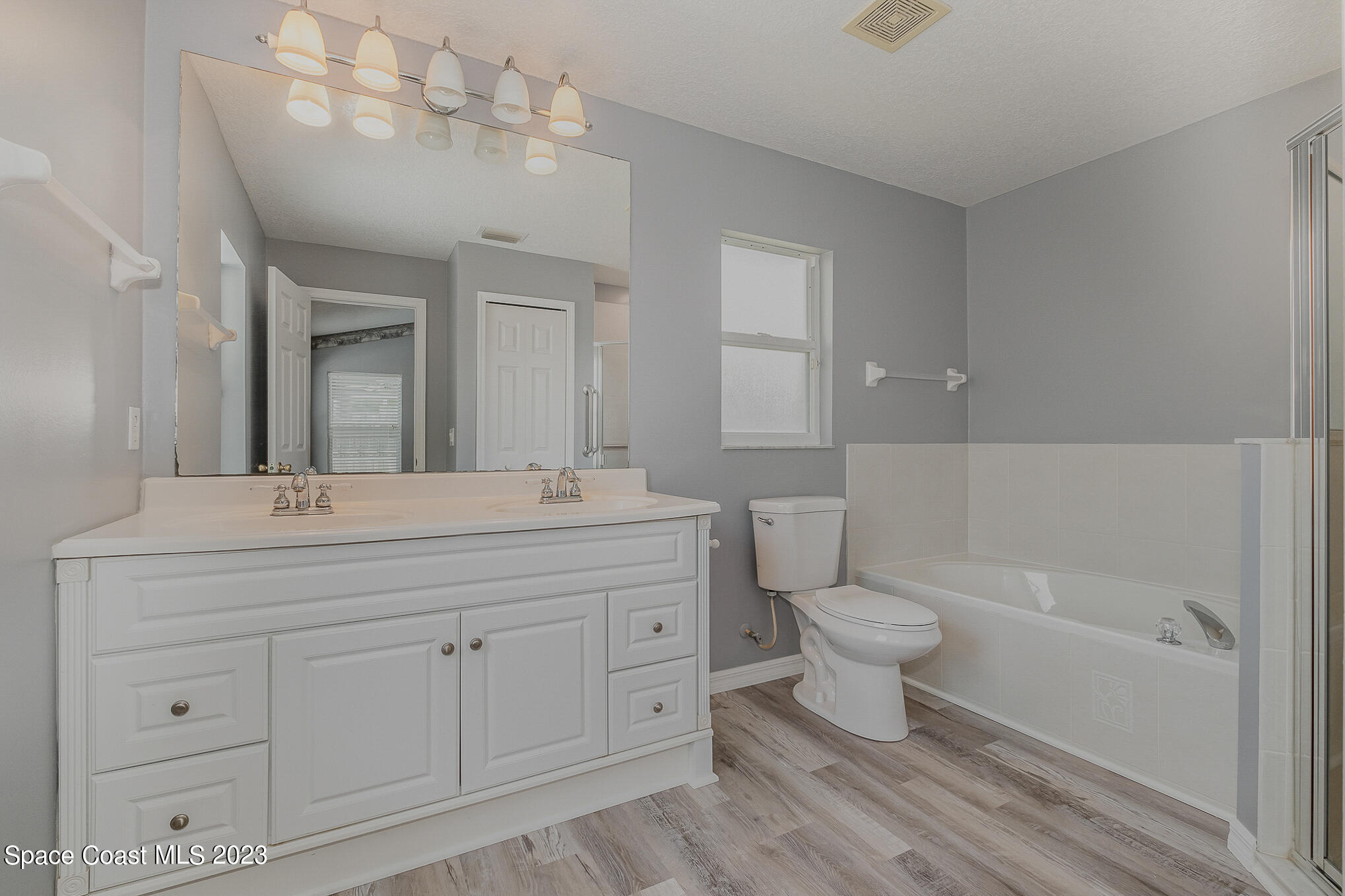 3910 La Flor Drive Rockledge, FL 32955 - Photo 15 of 24 a bathroom with a toilet sink and mirror