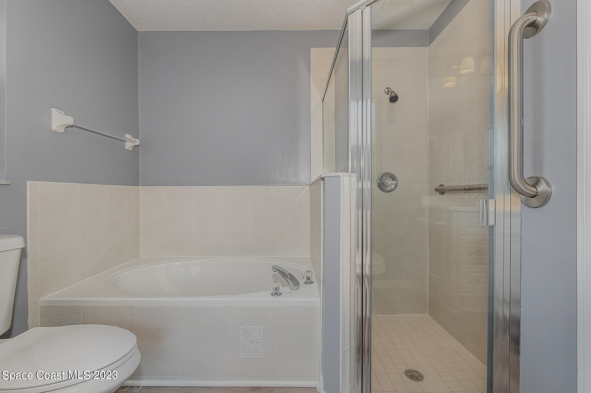 3910 La Flor Drive Rockledge, FL 32955 - Photo 16 of 24 a bathroom with a bathtub and a shower