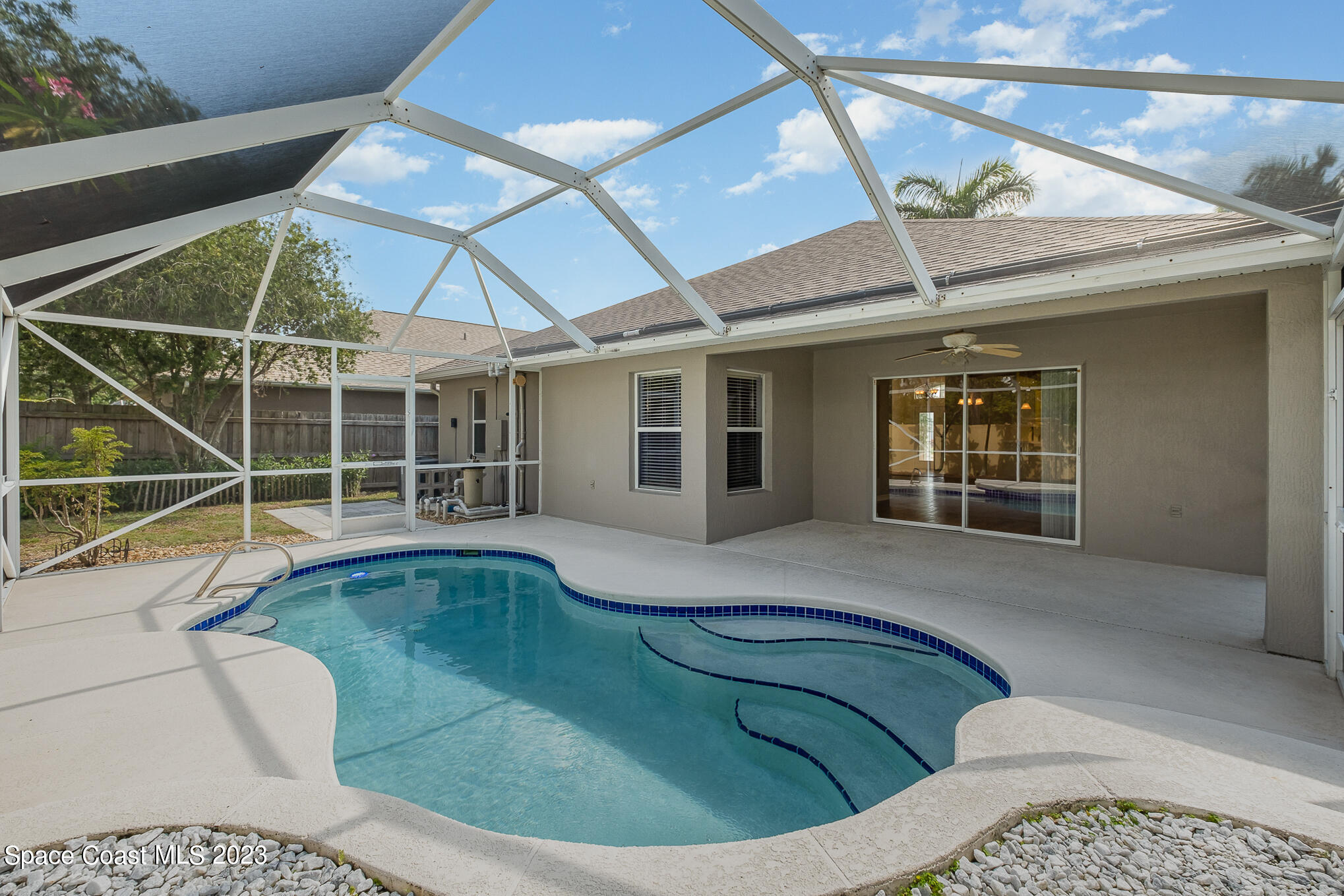 3910 La Flor Drive Rockledge, FL 32955 - Photo 20 of 24 a view of a house with a swimming pool