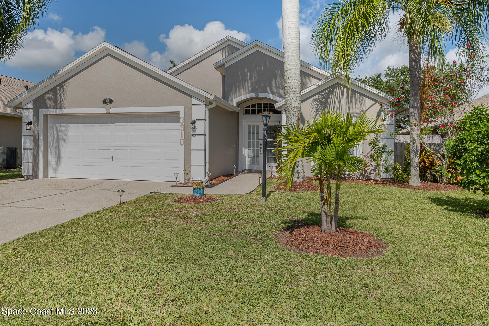 3910 La Flor Drive Rockledge, FL 32955 - Photo 2 of 24 a front view of a house with a yard