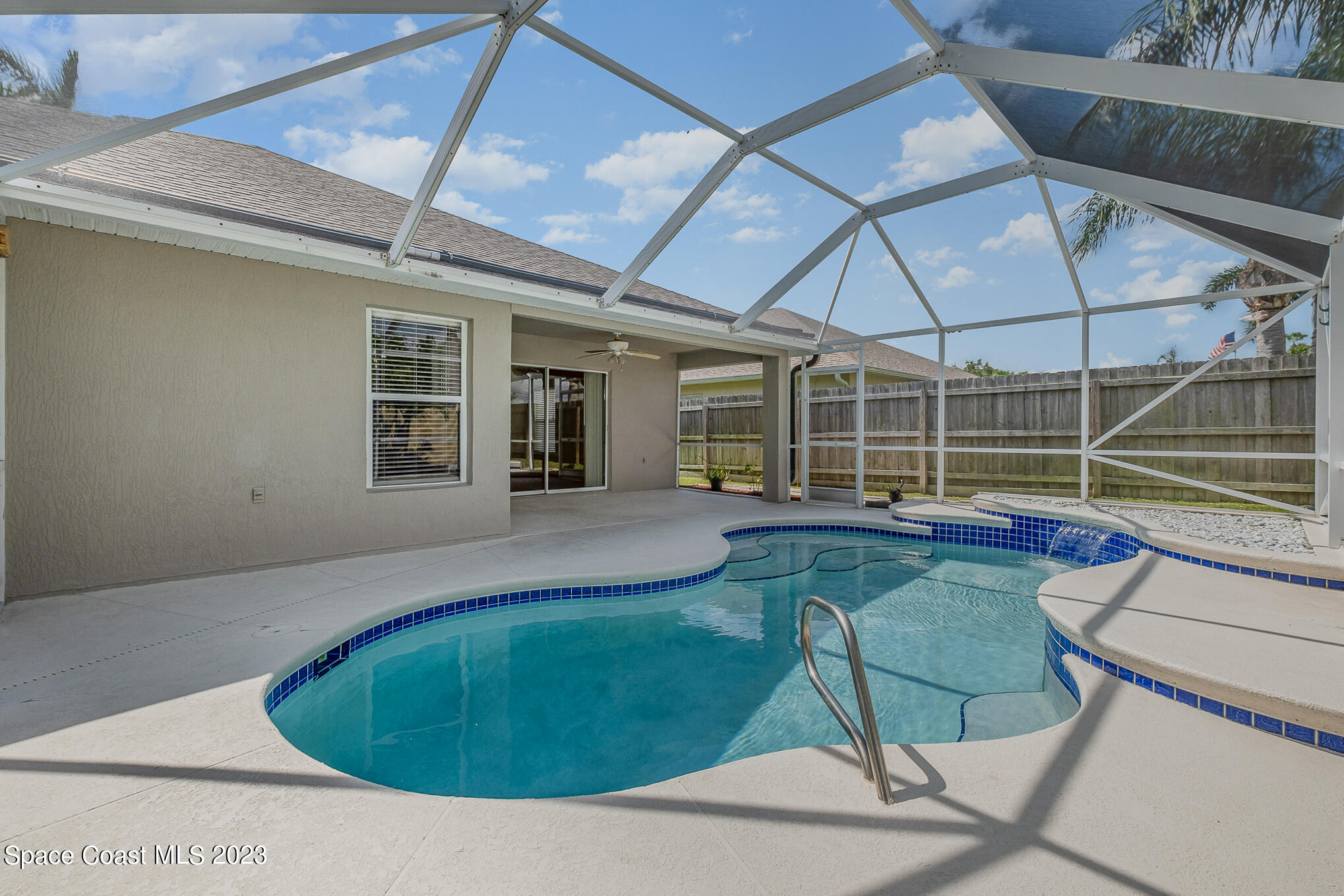 3910 La Flor Drive Rockledge, FL 32955 - Photo 21 of 24 a view of a house with backyard sitting area and tub