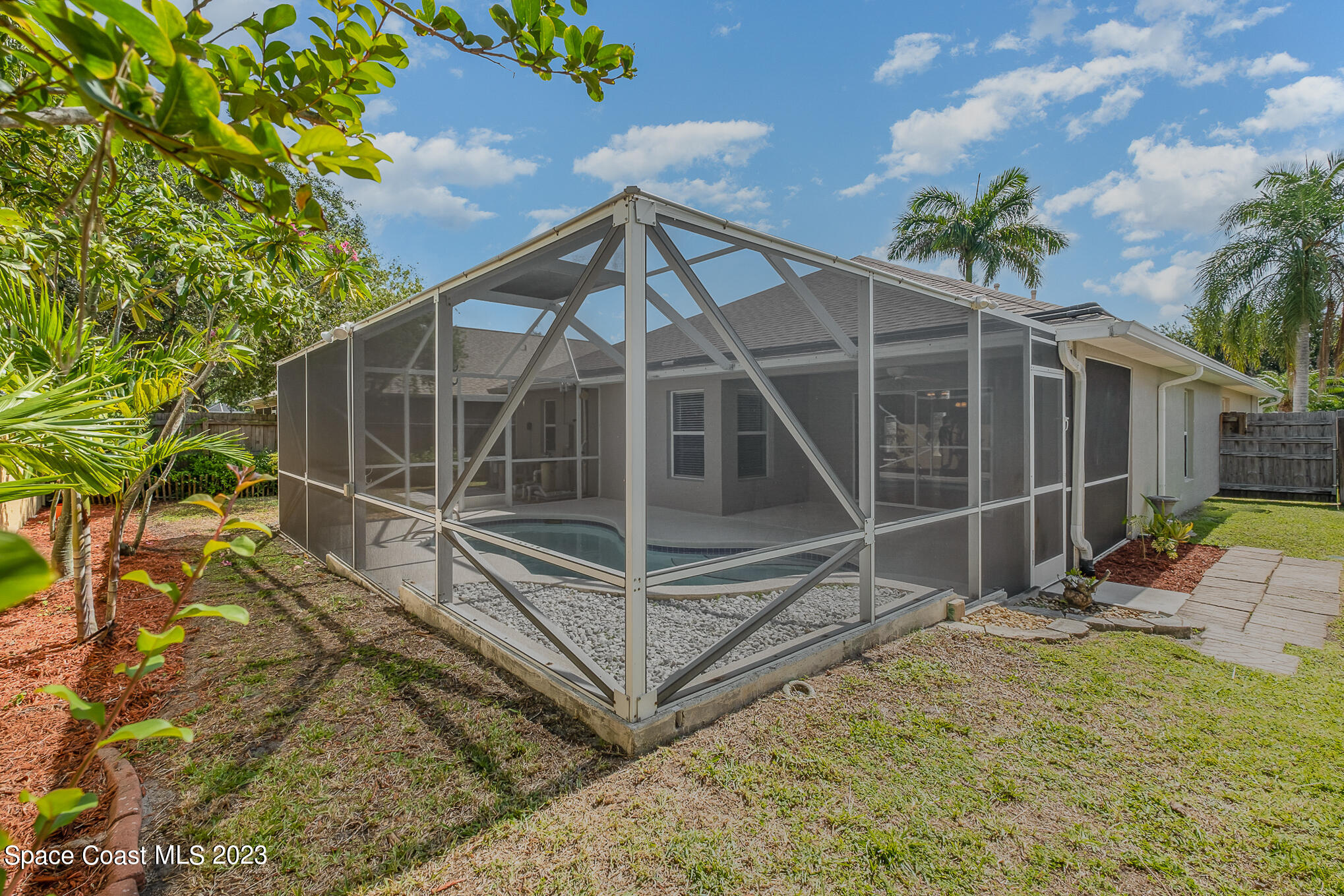 3910 La Flor Drive Rockledge, FL 32955 - Photo 24 of 24 a view of a house with backyard and wooden fence