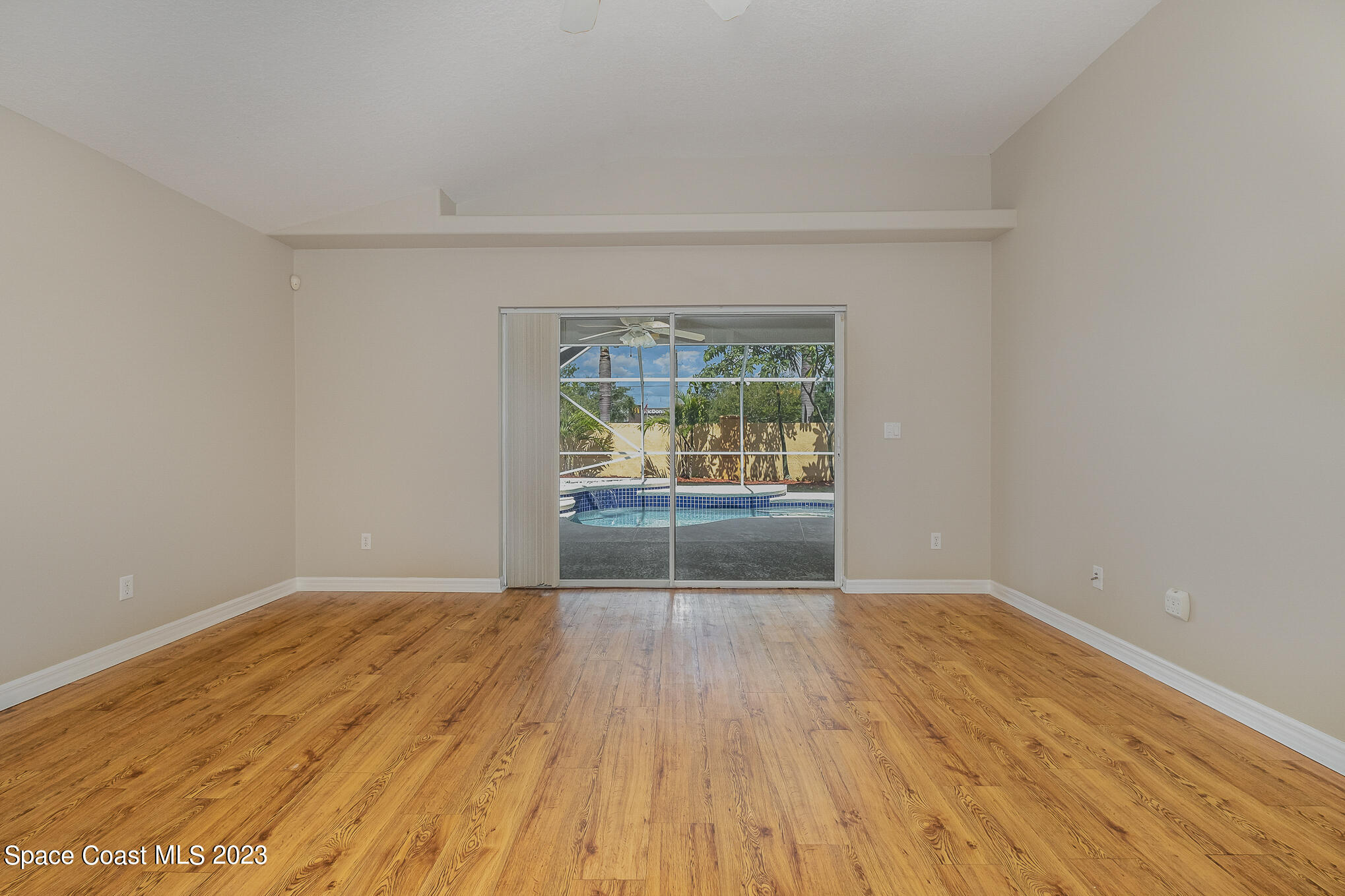 3910 La Flor Drive Rockledge, FL 32955 - Photo 7 of 24 wooden floor in an empty room with a window
