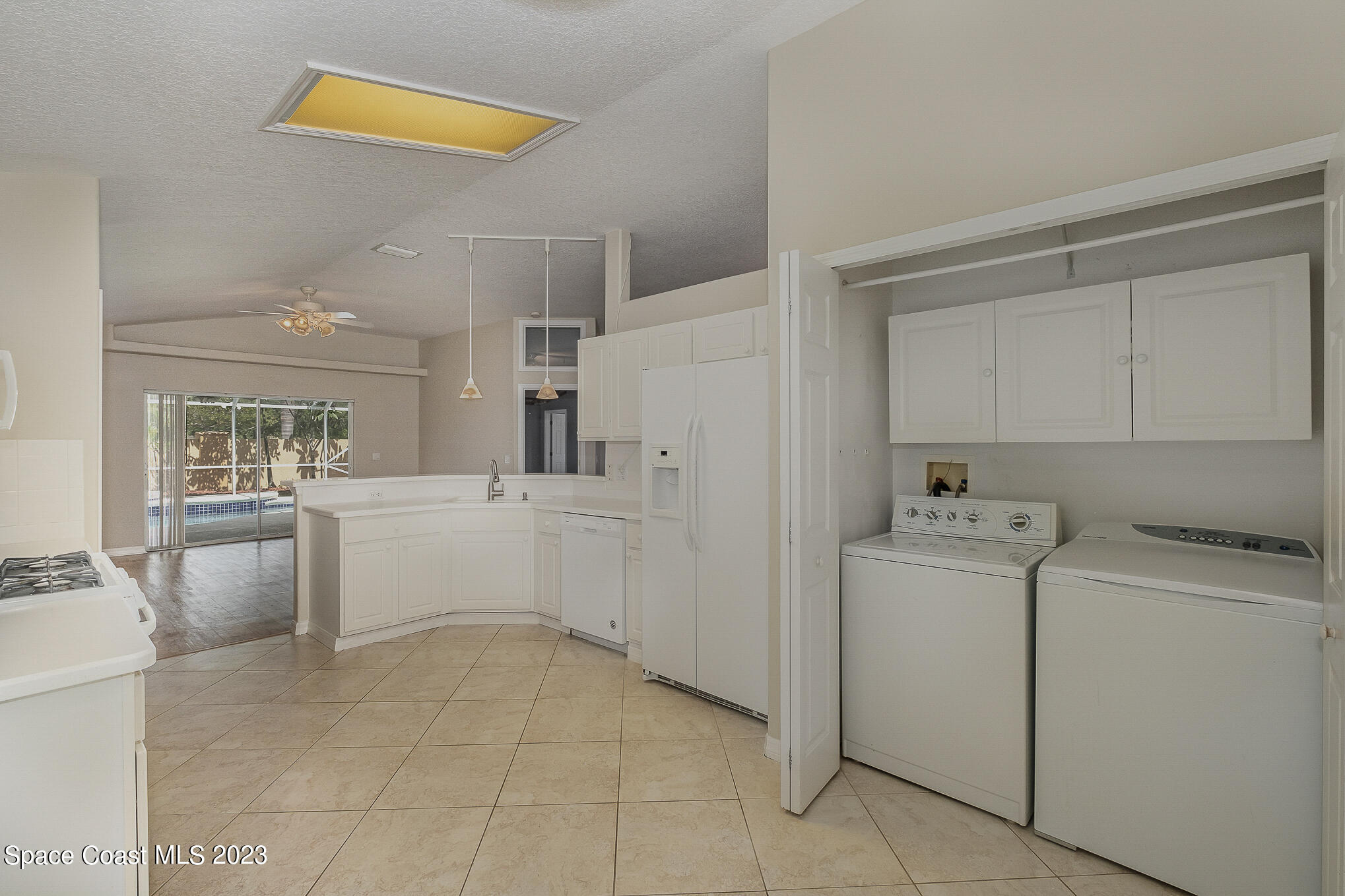 3910 La Flor Drive Rockledge, FL 32955 - Photo 9 of 24 a kitchen with a cabinets and appliances