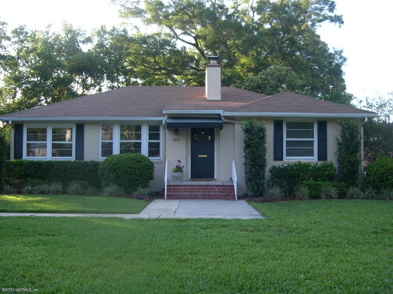 4145 London Road Jacksonville, FL 32207 - Photo 1 of 12 a front view of a house with a yard and green space