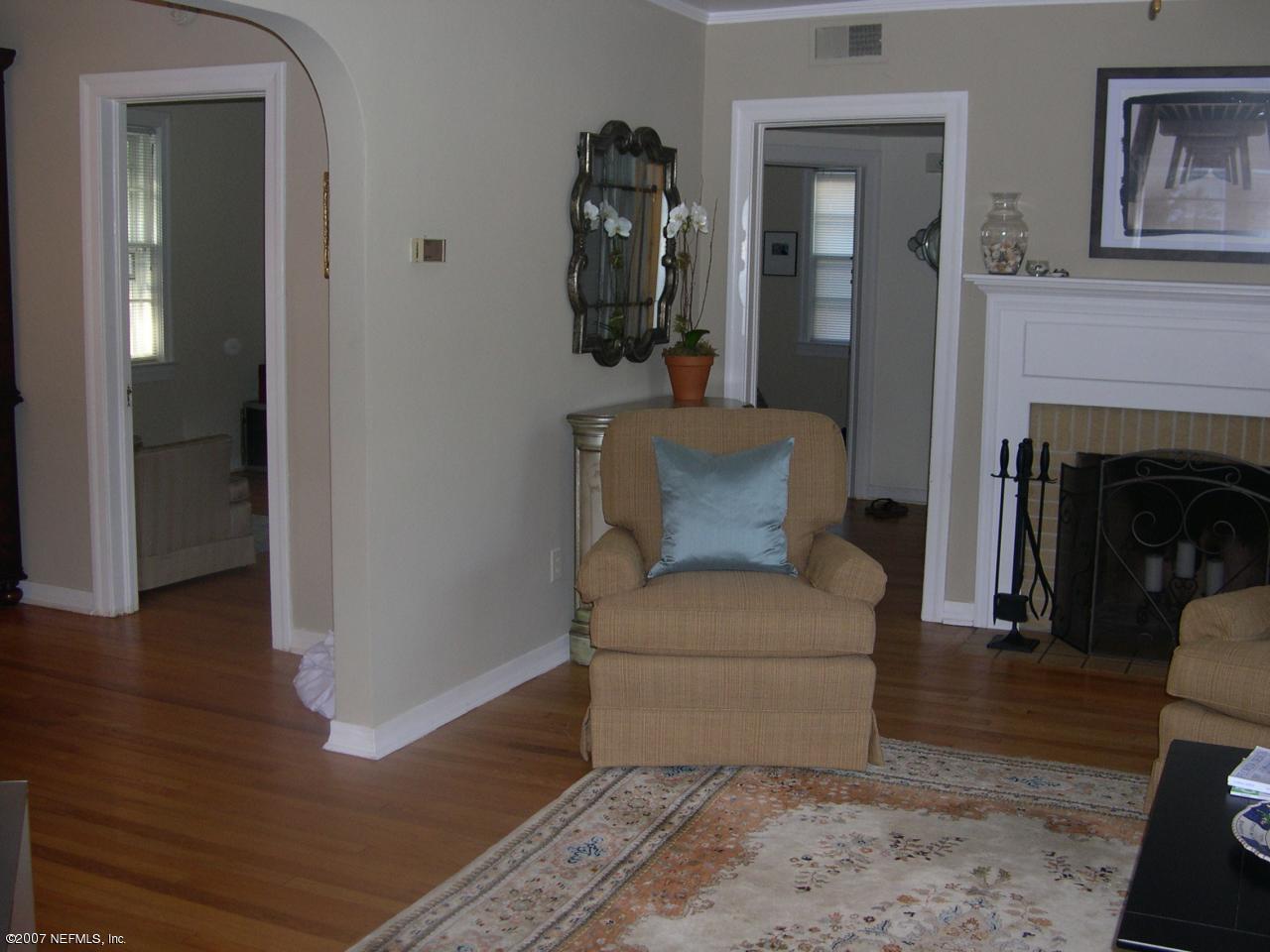 4145 London Road Jacksonville, FL 32207 - Photo 2 of 12 a living room with furniture and a fireplace