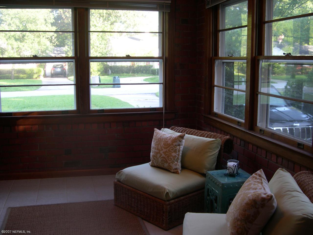 4145 London Road Jacksonville, FL 32207 - Photo 10 of 12 a picture of a couch in front of a window