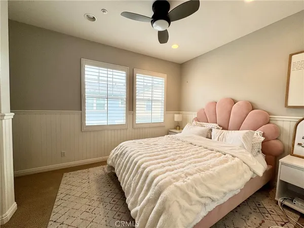 a bedroom with bed and a window