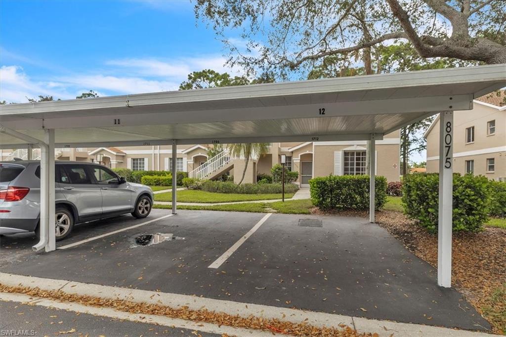 8075 Tiger Cove, Unit 1706 Naples, FL 34113 - Photo 41 of 50 a view of a car garage