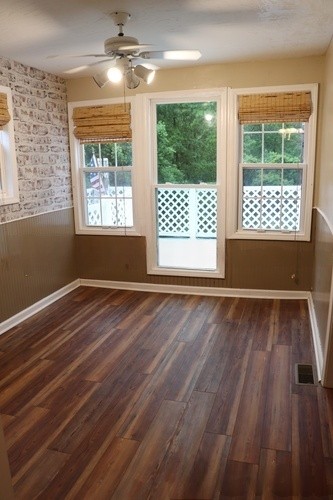 209 Church Street Dover, TN 37058 - Photo 12 of 16 a view of an empty room with wooden floor and a window