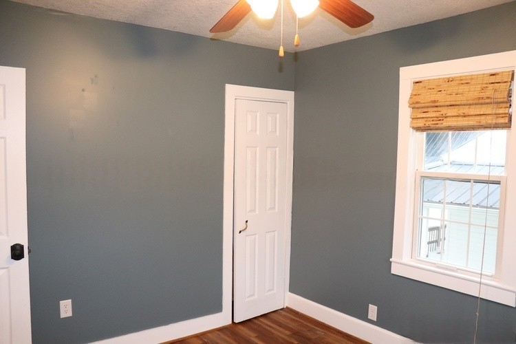 209 Church Street Dover, TN 37058 - Photo 14 of 16 a view of an empty room with window and wooden floor